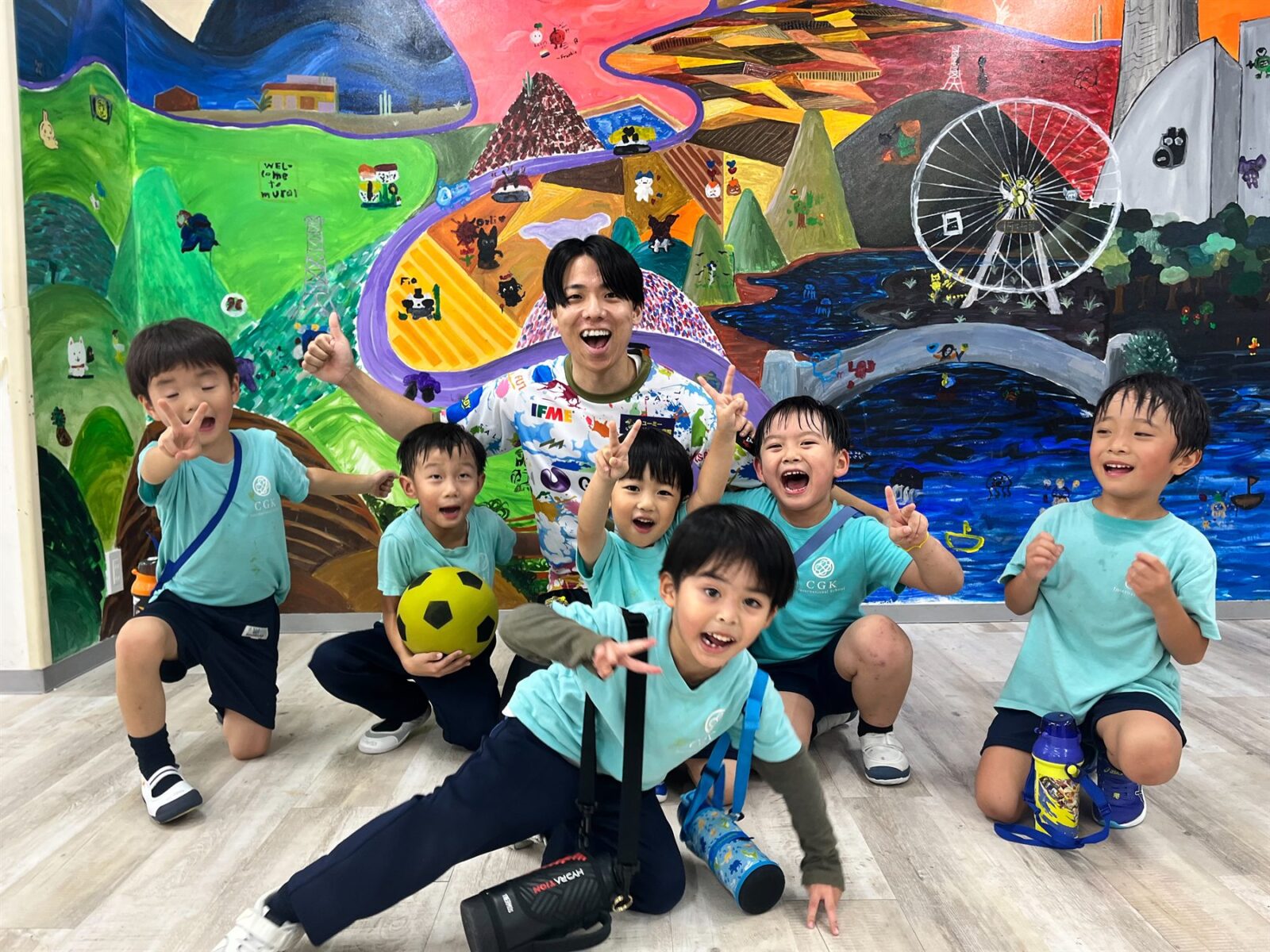Seiya Kitano and CGK Preschool children smiling together